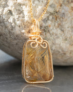 Load image into Gallery viewer, small trapezoid golden rutilated quartz pendant