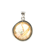 Load image into Gallery viewer, round golden rutilated quartz pendant in silver setting