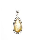 Load image into Gallery viewer, teardrop golden rutilated quartz pendant in silver setting
