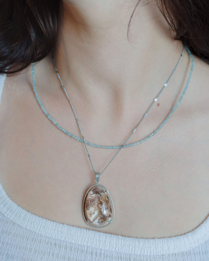 seabed world phantom quartz pendant in silver setting